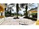 Lovely courtyard with water fountain, beautiful landscaping, and tiled walkway at 1400 Lake Shadow Cir # 10105, Maitland, FL 32751