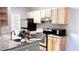 Kitchen featuring granite countertops, stainless steel appliances, and natural wood cabinets at 1400 Lake Shadow Cir # 10105, Maitland, FL 32751