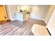 Living space showcases modern wood flooring and breakfast bar access to the updated kitchen at 1400 Lake Shadow Cir # 10105, Maitland, FL 32751
