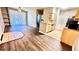 Living room with wood floors, open floor plan, and view into kitchen with breakfast bar at 1400 Lake Shadow Cir # 10105, Maitland, FL 32751