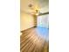 Living room features wood floors, exterior access, and open floorplan at 1400 Lake Shadow Cir # 10105, Maitland, FL 32751