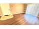 Living area features wood flooring, access to front door and sliding doors to exterior at 1400 Lake Shadow Cir # 10105, Maitland, FL 32751
