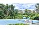 This property includes a tennis court surrounded by lush greenery, offering a private and scenic playing experience at 1400 Lake Shadow Cir # 10105, Maitland, FL 32751