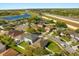 An aerial view of a residential area, highlighting community layout, landscaping, and nearby amenities at 14645 Tullamore Loop, Winter Garden, FL 34787