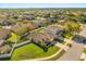 Aerial view of the neighborhood featuring well-maintained homes and lush landscaping at 14645 Tullamore Loop, Winter Garden, FL 34787
