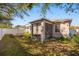 Cozy screened in patio and backyard with privacy fence and shade trees at 14645 Tullamore Loop, Winter Garden, FL 34787