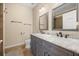 Elegant bathroom showcasing double sinks, marble countertops, and modern fixtures at 14645 Tullamore Loop, Winter Garden, FL 34787