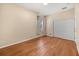 A cozy bedroom featuring hardwood floors, natural light, and a closet at 14645 Tullamore Loop, Winter Garden, FL 34787