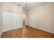 Bedroom featuring hardwood floors, neutral walls and a closet with double doors at 14645 Tullamore Loop, Winter Garden, FL 34787