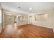 Spacious living room featuring rich hardwood floors and lots of natural light at 14645 Tullamore Loop, Winter Garden, FL 34787