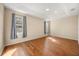 A spacious main bedroom with hardwood floors, trey ceiling and natural light from the windows at 14645 Tullamore Loop, Winter Garden, FL 34787