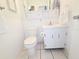 Bright bathroom features white cabinets, stylish fixtures and tile backsplash at 1600 W Lake Parker Dr # D5, Lakeland, FL 33805