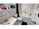 Bright bathroom featuring white tiled walls, a shower/tub combo and a sleek vanity at 1600 W Lake Parker Dr # D5, Lakeland, FL 33805