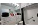 Bathroom featuring white tiled walls, a shower/tub combo and a sleek vanity at 1600 W Lake Parker Dr # D5, Lakeland, FL 33805