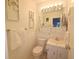 Bathroom featuring tile walls, a mirror, and a vanity providing functionality and a clean aesthetic at 1600 W Lake Parker Dr # D5, Lakeland, FL 33805