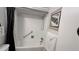 Bathroom featuring white tiled walls, a shower/tub combo and sleek white fixtures at 1600 W Lake Parker Dr # D5, Lakeland, FL 33805