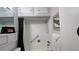 Bathroom featuring white tiled walls, a shower/tub combo and sleek white fixtures at 1600 W Lake Parker Dr # D5, Lakeland, FL 33805