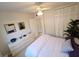 Well-lit bedroom with ample storage, white walls, and soft natural lighting at 1600 W Lake Parker Dr # D5, Lakeland, FL 33805