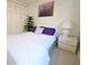 Bright bedroom featuring a comfortable bed, and nightstand at 1600 W Lake Parker Dr # D5, Lakeland, FL 33805
