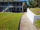 Apartment building with well-kept landscaping and a convenient walking path, set in a peaceful environment at 1600 W Lake Parker Dr # D5, Lakeland, FL 33805