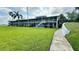 Apartment building with well-kept landscaping and a convenient walking path, set in a peaceful environment at 1600 W Lake Parker Dr # D5, Lakeland, FL 33805