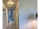 Bright hallway featuring tiled flooring and white walls at 1600 W Lake Parker Dr # D5, Lakeland, FL 33805