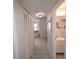 Hallway view leading to a bathroom with a vanity and tiled floors at 1600 W Lake Parker Dr # D5, Lakeland, FL 33805