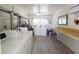 Bright community laundry room with multiple washers, dryers, and ample counter space, offering convenience for residents at 1600 W Lake Parker Dr # D5, Lakeland, FL 33805