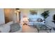 Inviting living room with classic furnishings, large windows, and views of the dining area at 1600 W Lake Parker Dr # D5, Lakeland, FL 33805
