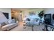 Comfortable living room with sofas, a glass-top coffee table, neutral colors, and attractive decor at 1600 W Lake Parker Dr # D5, Lakeland, FL 33805
