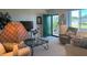 Inviting living room features a green door, plush seating, and well-lit space at 1600 W Lake Parker Dr # D5, Lakeland, FL 33805