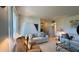 Bright living room with tile floors, large windows, and elegant furniture arrangement at 1600 W Lake Parker Dr # D5, Lakeland, FL 33805