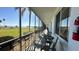 A screened porch with seating and views of the lake, perfect for relaxing outdoors at 1600 W Lake Parker Dr # D5, Lakeland, FL 33805