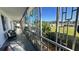 Inviting screened-in porch with comfortable seating and views of the lush landscaping at 1600 W Lake Parker Dr # D5, Lakeland, FL 33805