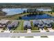 Aerial view showcases the property's prime location with lake access and well-maintained landscaping at 16781 Meadows St, Clermont, FL 34714