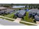 Property aerial view showing home's location near a lake and surrounding residential area at 16781 Meadows St, Clermont, FL 34714