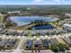 Community aerial view featuring the home's location near a scenic lake and lush surroundings at 16781 Meadows St, Clermont, FL 34714
