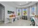 Spacious craft room featuring multiple workstations, natural light, and organized storage for sewing and crafting supplies at 16781 Meadows St, Clermont, FL 34714