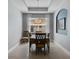 Dining room featuring a decorative chandelier and arched walls offering a view of the home's exterior at 16781 Meadows St, Clermont, FL 34714