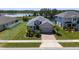 Charming single-Gathering home boasts a beautifully landscaped yard and serene water views at 16781 Meadows St, Clermont, FL 34714
