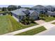 Beautifully landscaped single-Gathering home with a paver driveway and lush green lawn at 16781 Meadows St, Clermont, FL 34714