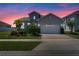 Charming single-Gathering home with a two-car garage, paver driveway, and well-maintained landscaping at 16781 Meadows St, Clermont, FL 34714