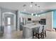 Spacious kitchen with a large island, stainless steel appliances, and pendant lighting at 16781 Meadows St, Clermont, FL 34714