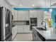 Modern kitchen featuring stainless steel appliances, granite countertops, and ample cabinet space at 16781 Meadows St, Clermont, FL 34714