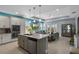 Bright and airy living space with open floor plan, blending kitchen and living areas for modern living at 16781 Meadows St, Clermont, FL 34714