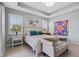 Calm main bedroom with tray ceilings, ample light from large windows, and comfortable furnishings at 16781 Meadows St, Clermont, FL 34714