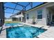 Enclosed pool features a spa, patio, and screened-in enclosure at 16781 Meadows St, Clermont, FL 34714