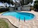 Backyard features a newly resurfaced kidney-shaped pool and new brick paver decking, perfect for outdoor enjoyment at 170 Lady Susan Ct, Casselberry, FL 32707