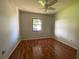 The bedroom features a ceiling fan and a window that lets in natural light at 170 Lady Susan Ct, Casselberry, FL 32707