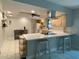 Kitchen with breakfast bar, stainless vent hood, light wood cabinetry, and white appliances at 170 Lady Susan Ct, Casselberry, FL 32707